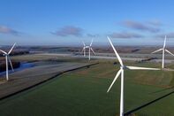 Wind Turbines In Frosty Fields In Winter