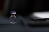 An example of the Pfizer Covid-19 vaccine vial during a Senate Commerce Committee hearing in Washington, D.C., U.S., on Thursday, Dec. 10, 2020. The hearing examines the logistics of transporting a Covid-19 vaccine.