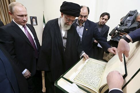 Khamenei receives a replica of an ancient handwritten Koran from Putin.