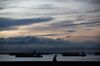 Ships sit moored at sunrise in Singapore, Singapore, on Monday, Feb. 10, 2020. Singaporean health officials are trying to trace three new cases to see if theyre linked to previous coronavirus infections or travel to mainland China. The global death toll from the coronavirus outbreak reached 910, as the World Health Organizations chief voiced concern over the spread of the disease from people with no travel history to China.