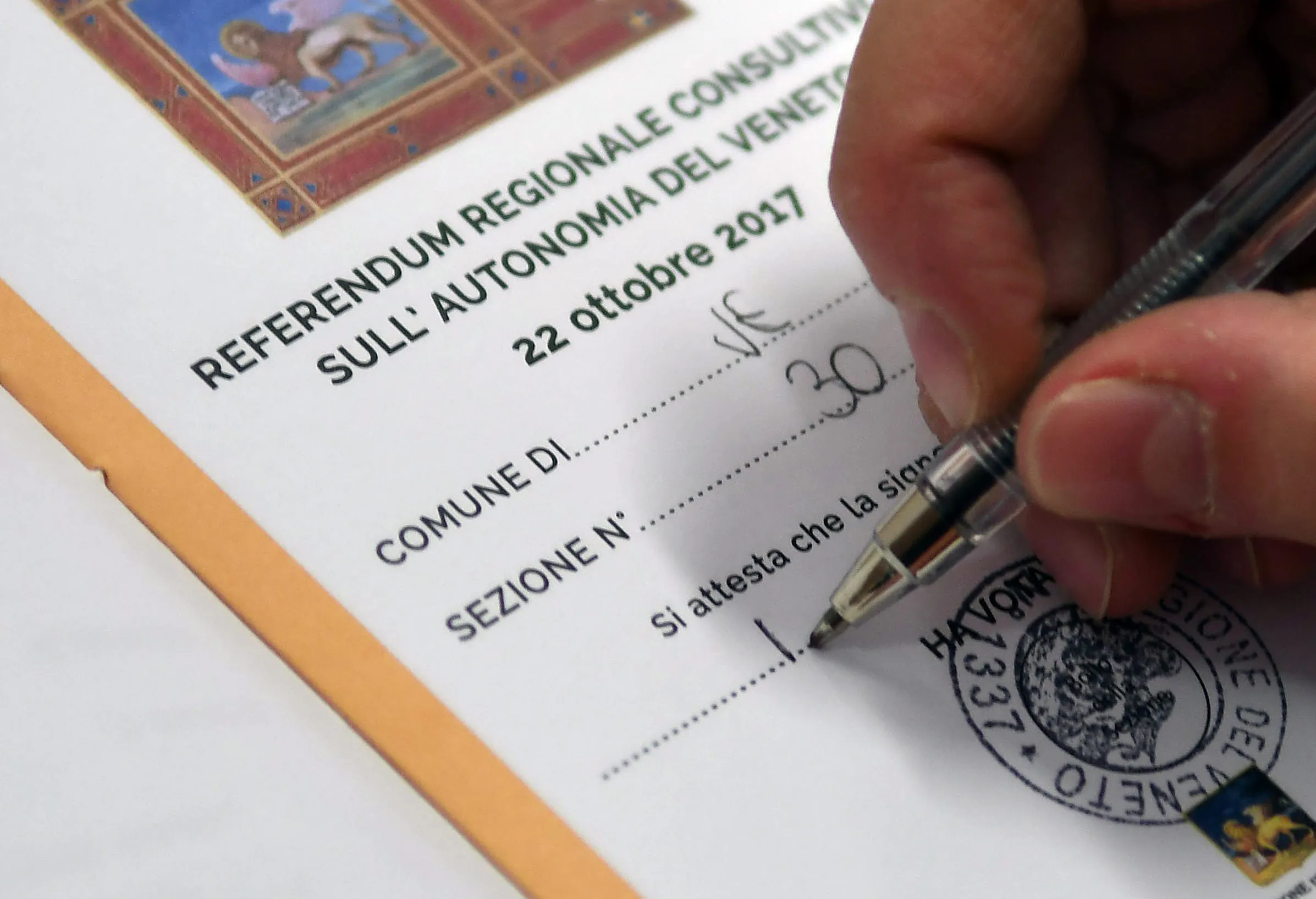 A polling station official prepares ballots papers to vote for a referendum in Venice on Oct. 22.
