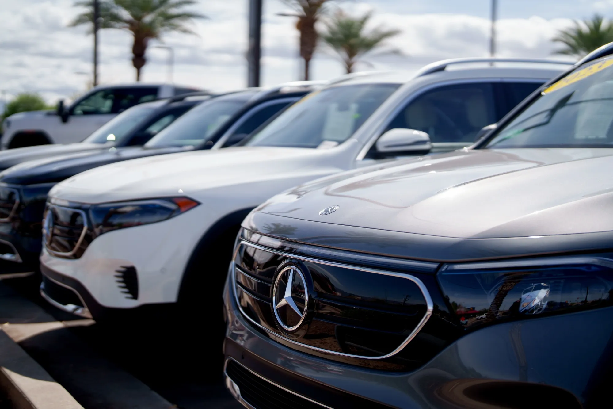 Used Mercedes-Benz EQB electric sport utility vehicles at a dealership in Tucson, Arizona.