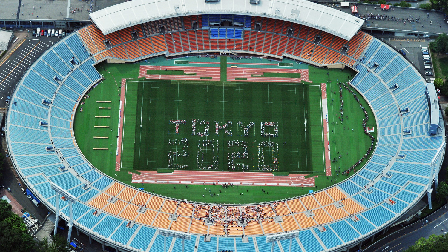 'Tokyo 2020' is formed by human letters prior to the Aisan Five Nations match between Japan and Hong Kong at the National Stadium in Tokyo on May 25, 2014.
