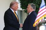 US President Donald Trump and Hungary's prime minister Viktor Orban shake hands outside the West Wing of the White House in Washington on Nov. 7.