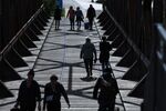 Pedestrians cross Zollbruecke bridge in Magdeburg, Germany, on Thursday, May 28, 2020. 