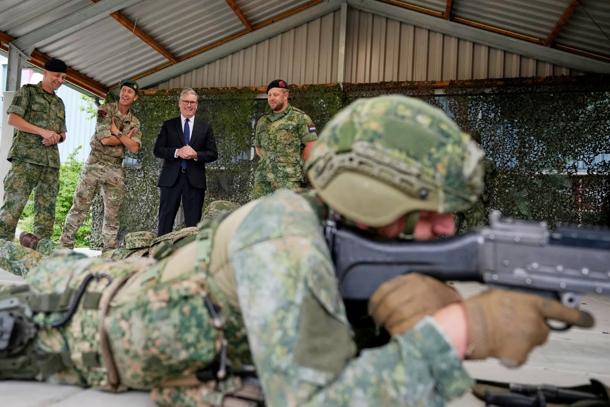 Keir Starmer speaks with soldiers during a visit to a Dutch army training center&nbsp;in The Hague, in June.