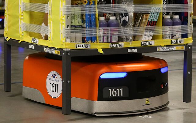  A Kiva robot moves a rack of merchandise at an Amazon fulfillment center in Tracy, California. 