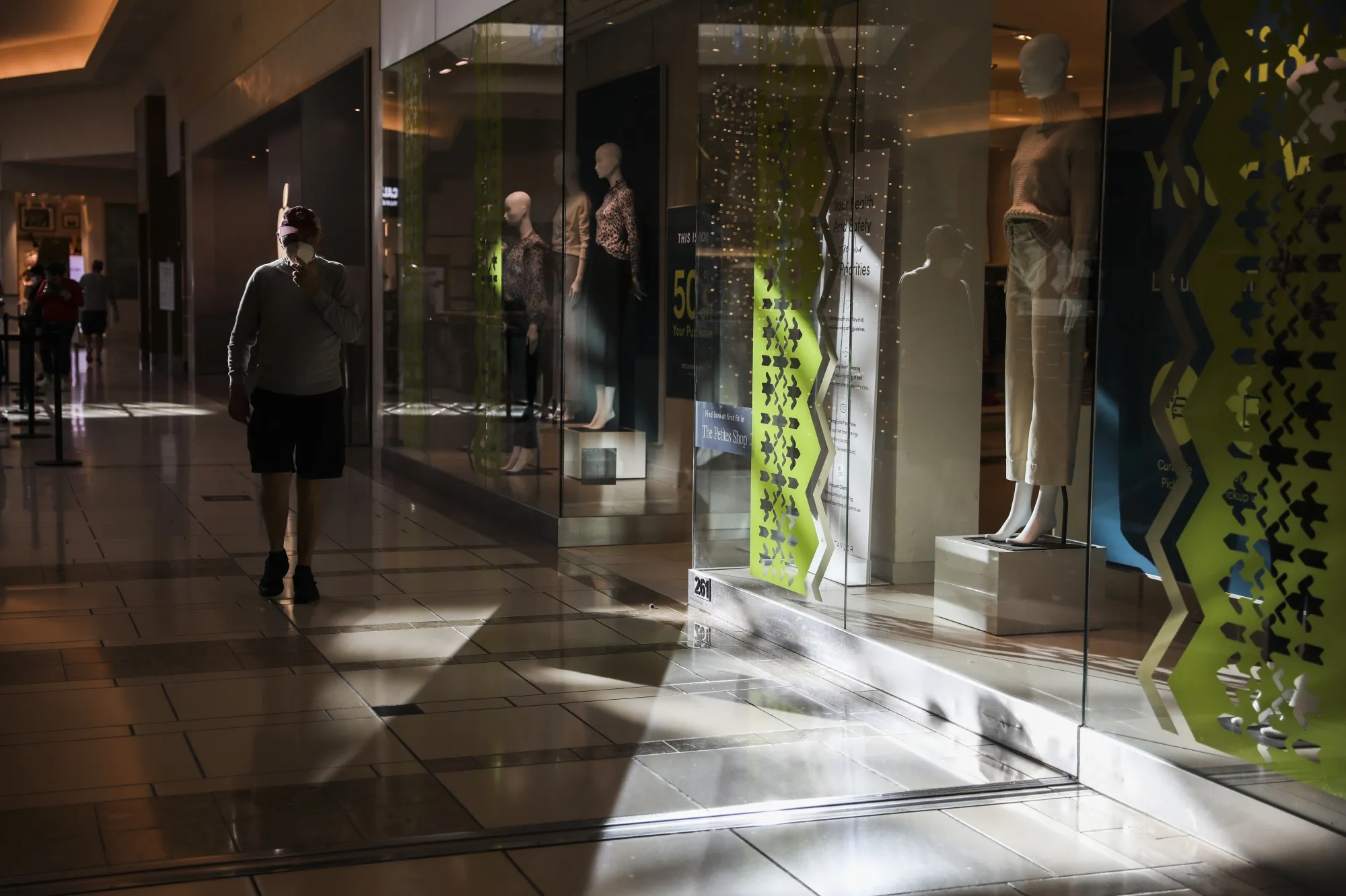 Shoppers walk through a mall in Tampa, Florida.