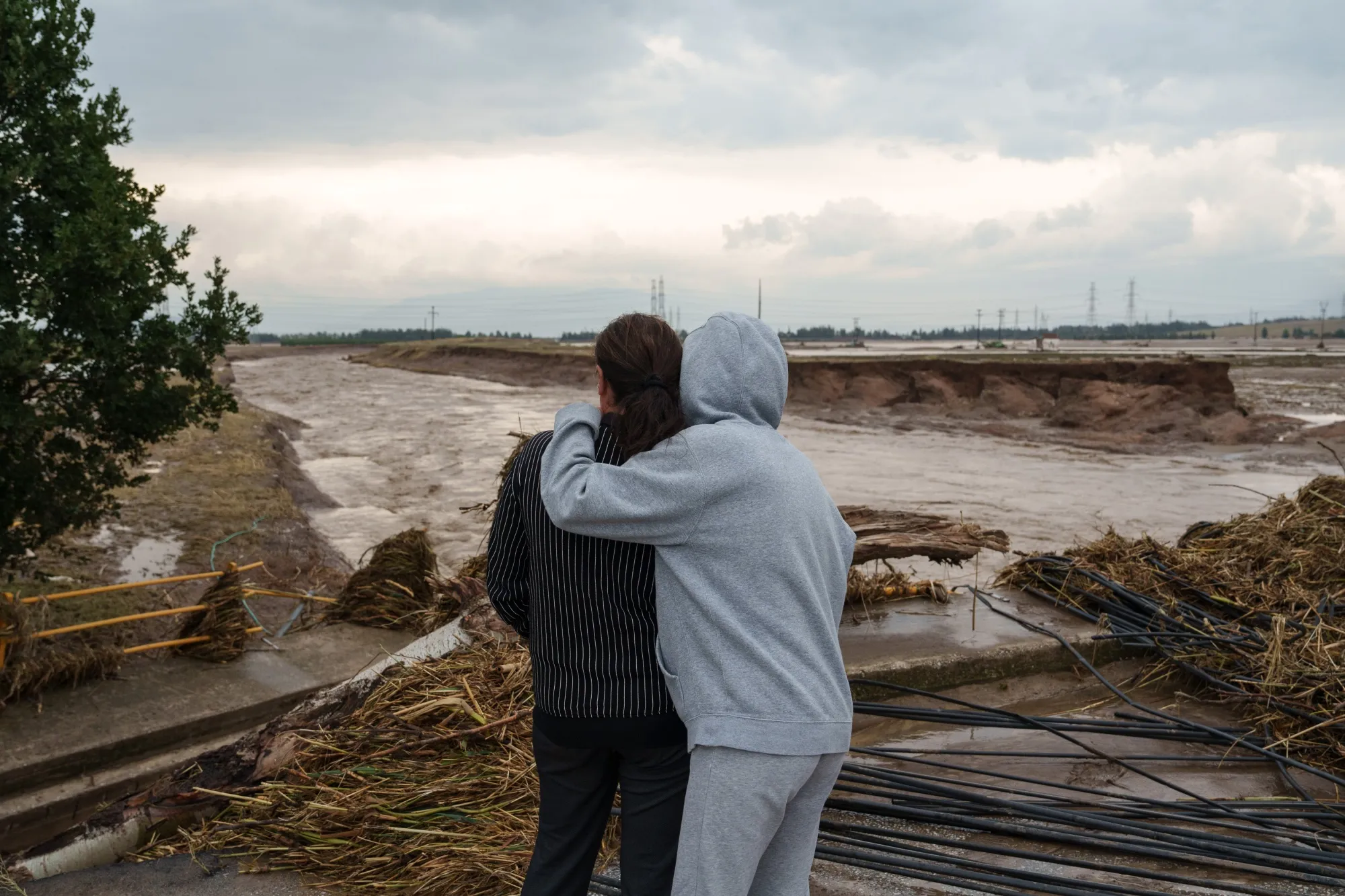 Residents look at the damage caused by floods following heavy rains in Greece. Finding funds to help adapt to the impacts of climate change remains a challenge.
