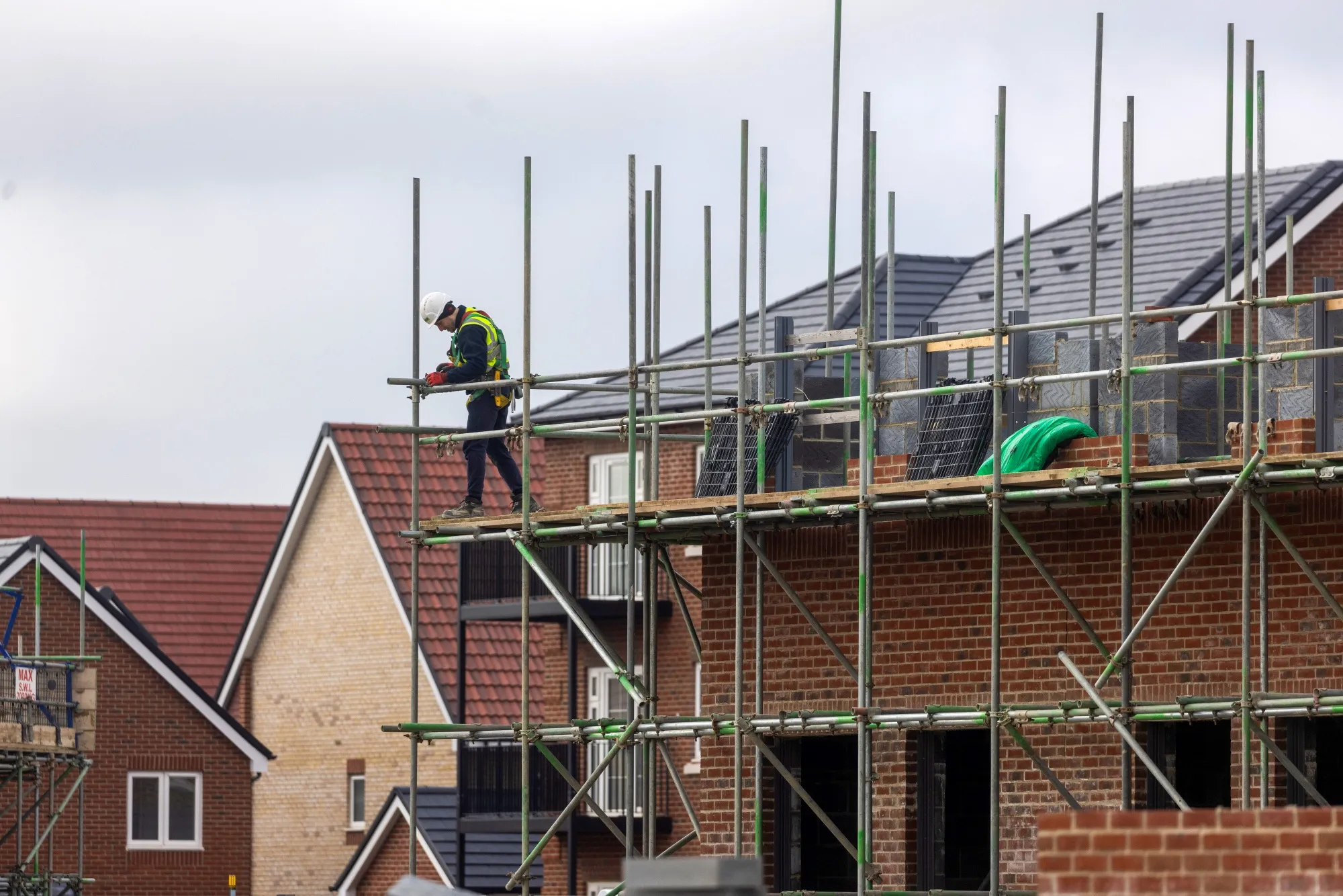 A worker at a construction site in Bishops Stortford, UK.