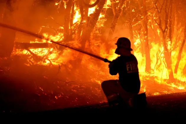 Fire crews fight a bushfire in Adelaide Hills, Australia on Jan. 2