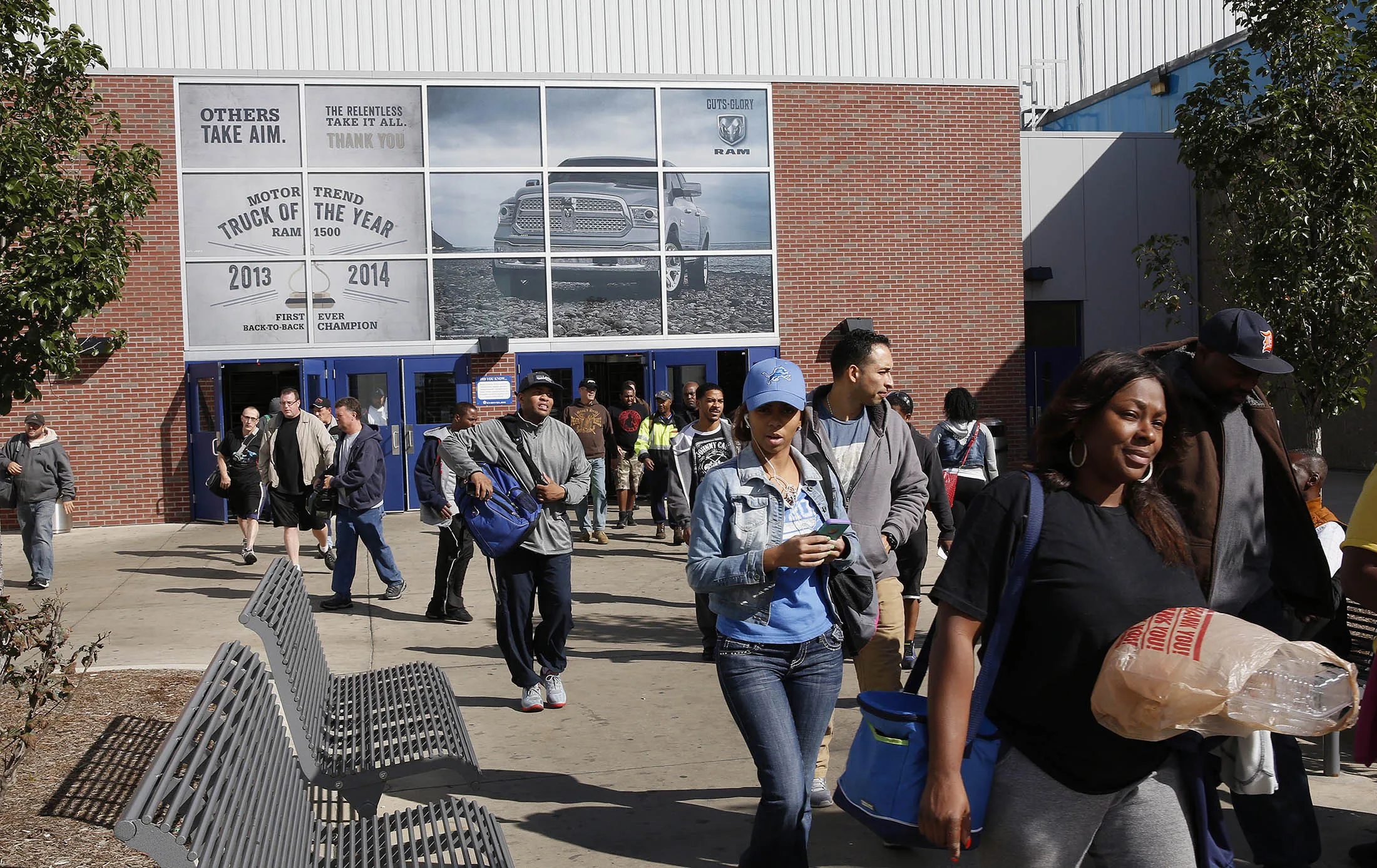 Workers exit during a shift change at the Fiat Chrysler Automobiles truck assembly plant in Warren, Michigan.
