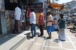 Customers stand in a queue outside a liquor shop&nbsp;in Chennai on March 21, 2020.&nbsp;