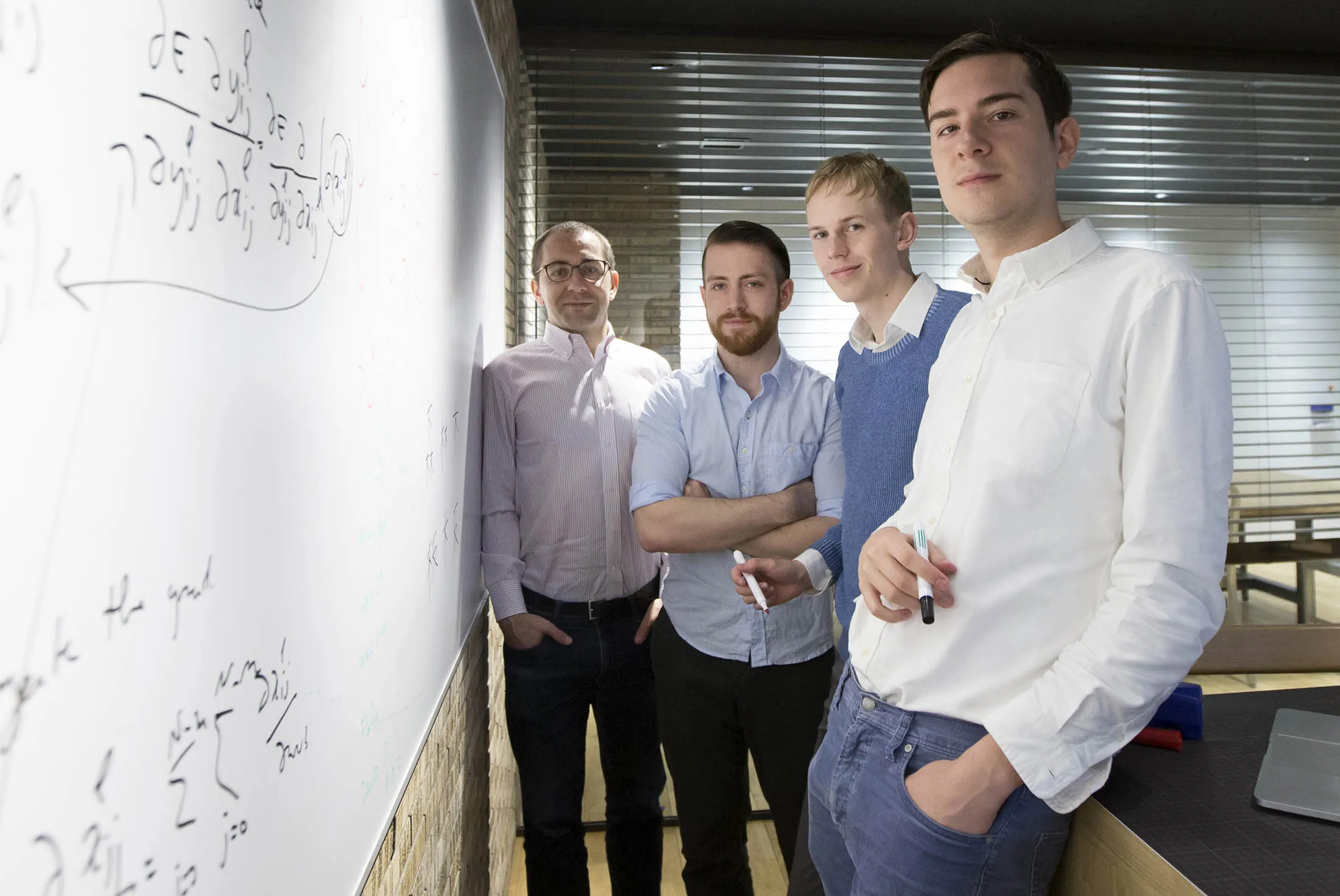 From left, data scientist David Malkin, core engineers Joseph Bullard and Philip Irri, and research engineer Philippe Remy of Reactive Inc. at Tenoha Lab in Tokyo.
