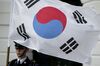 An honor guard member holds a South Korean flag in Washington, D.C., U.S..