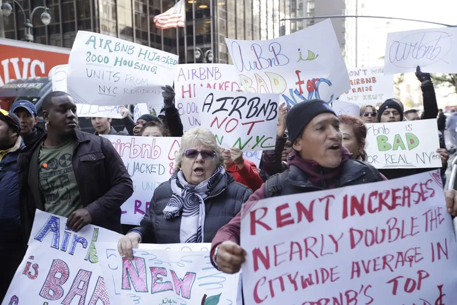 Protestors gather outside of New York Governor Andrew Cuomo's office on third avenue Wednesday, Oct. 26, 2016, in New York. Tech leaders and hundreds of Airbnb hosts gathered outside Cuomo's office to rally for 'fair' home-sharing laws.