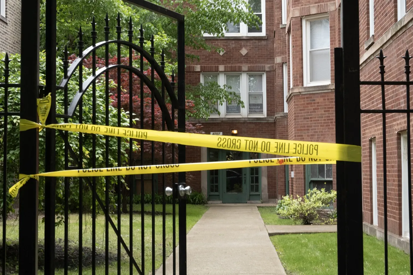 Crime scene tape stretched across the front of a building in Chicago in May.