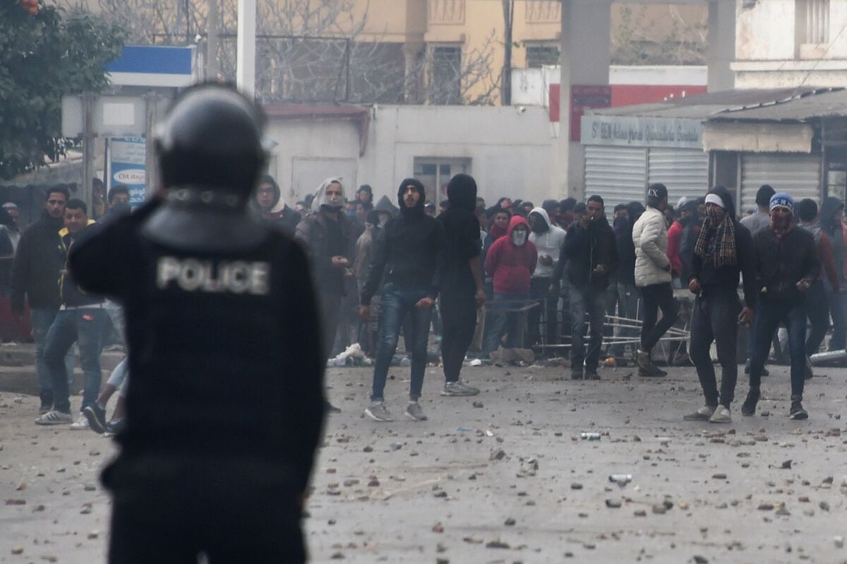 Tunisians Clash With Police As Protests Over Economy Build - Bloomberg