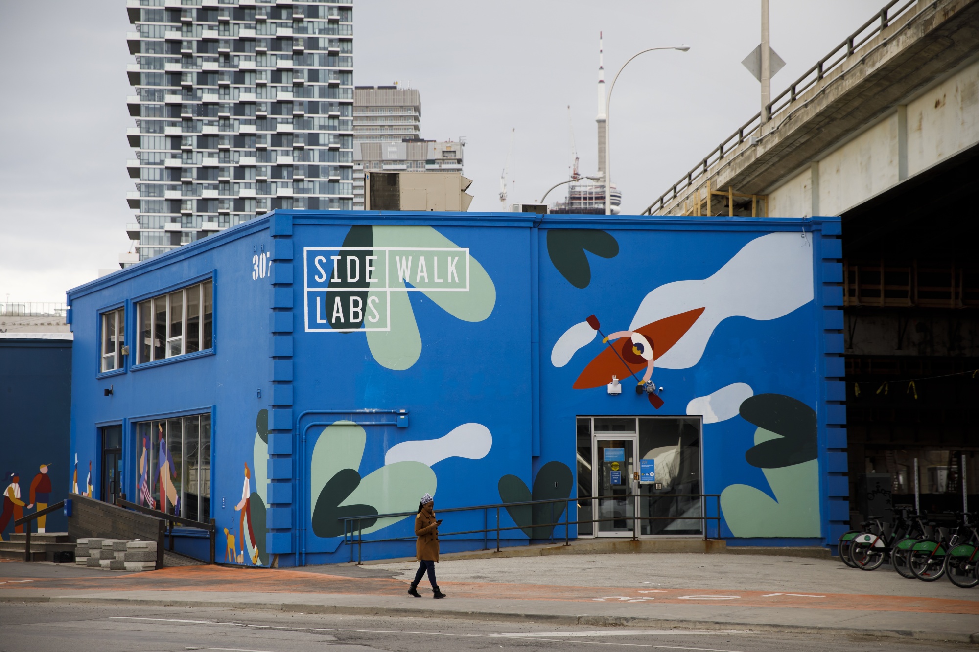 A pedestrian walks past Sidewalk Labs headquarters near the proposed site of 'Quayside' in Toronto, Ontario, Canada, on&nbsp;May 7.&nbsp;