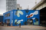 A pedestrian walks past Sidewalk Labs headquarters near the proposed site of 'Quayside' in Toronto, Ontario, Canada, on May 7. 