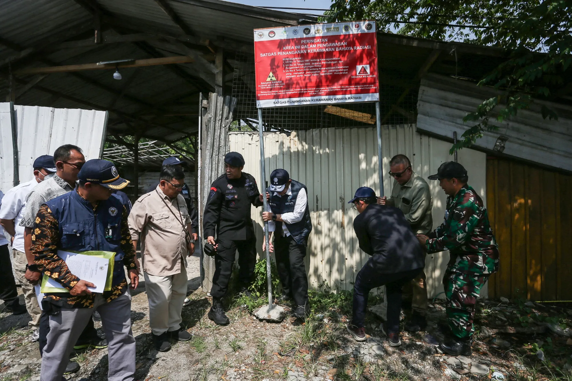Authorities have been working to clean up an industrial park where they say a small steel company appears to have smelted scrap metal mixed with cesium, contaminating various nearby factories.