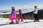 Family skiing time, winter activity, scenery, Baisoara Ski resort, Romania.