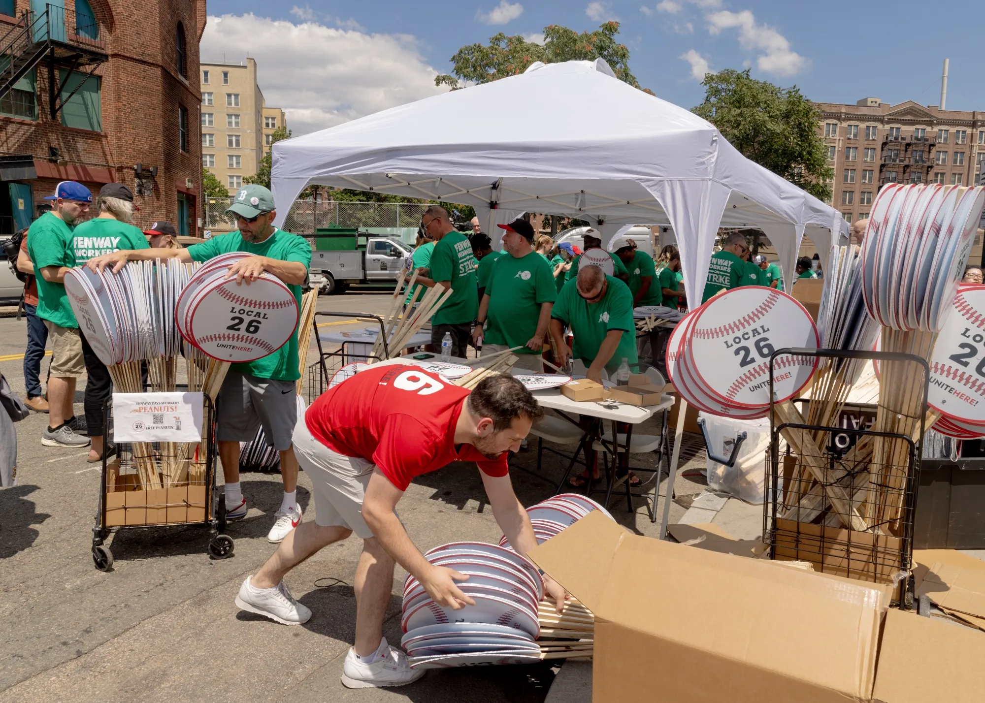 Workers assemble picket signs during a Unite Here Local 26 union event in Boston on Wednesday.