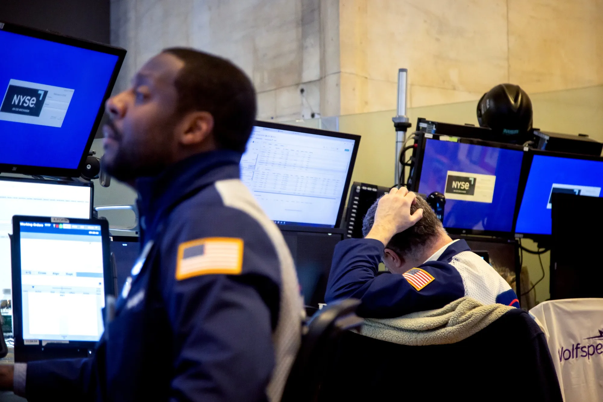 Traders work on the floor of the New York Stock Exchange.