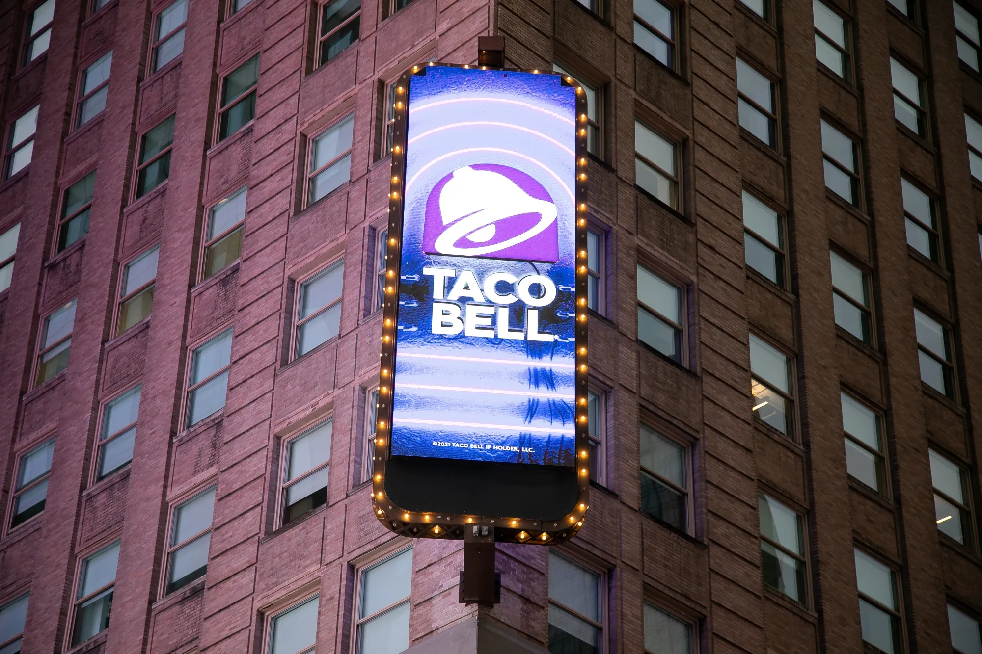 A Taco Bell sign in the Times Square neighborhood in New York, US