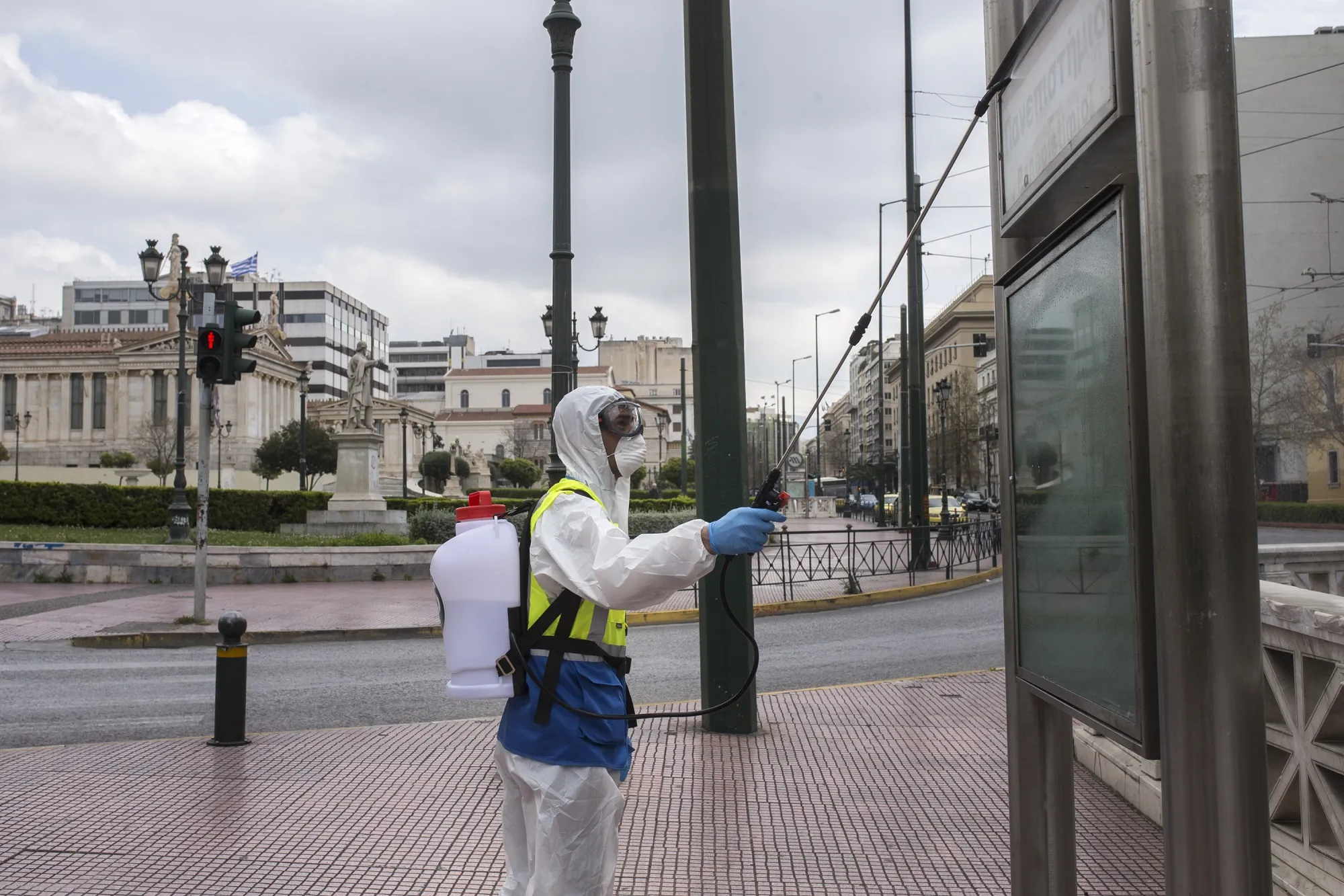 Officials carry out disinfection works at National Library of Greece and its surroundings in Athens, on April 1.