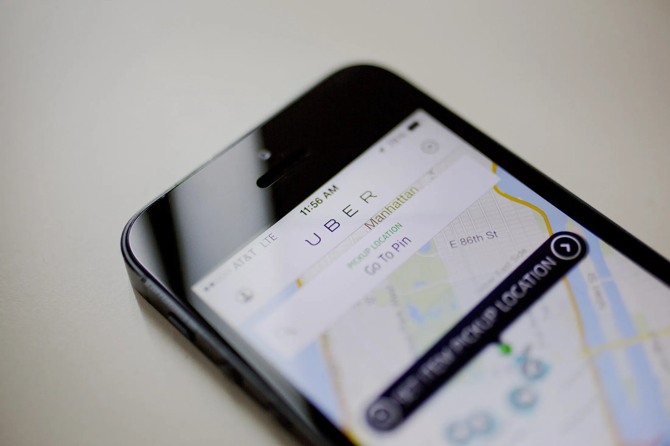 Th Uber Technologies Inc. car service application (app) is displayed for a photograph on an Apple Inc. iPhone in New York, U.S., on Wednesday, Aug. 6, 2014. For San Francisco-based Uber Technologies Inc. which recently raised $1.2 billion of investors' financing at $17 billion valuation, New York is its biggest by revenue among the 150 cities in which it operates across 42 countries. The Hamptons are a pop-up market for high-end season weekends where the average trip is three time that of an average trip in New York City.
