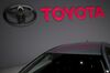 The Toyota Motor Corp. logo sits above a Corolla hybrid automobile on day two of the 89th Geneva International Motor Show in Geneva, Switzerland, on Wednesday, March 6, 2019. The show near Lake Leman, which opens to the public from March 7 to 17, will be the first gilded showcase of the year for the likes of Bugatti, Koenigsegg, Lamborghini, and Pininfarina, among others.