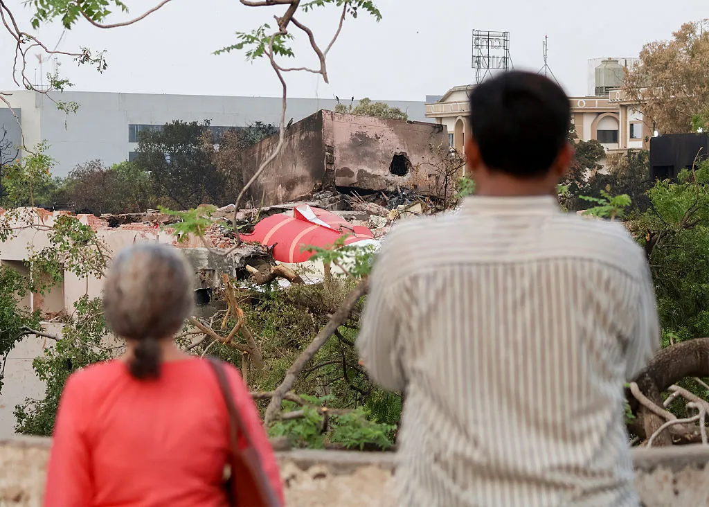 Onlookers at the Air India plane crash site.