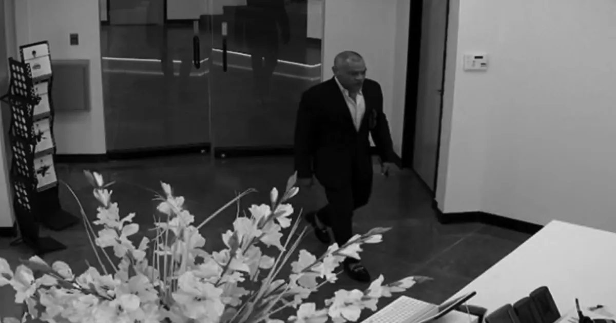Gino Gioe enters the Los Angeles office of Radiant Images on Feb. 15, 2018, captured by a surveillance camera.