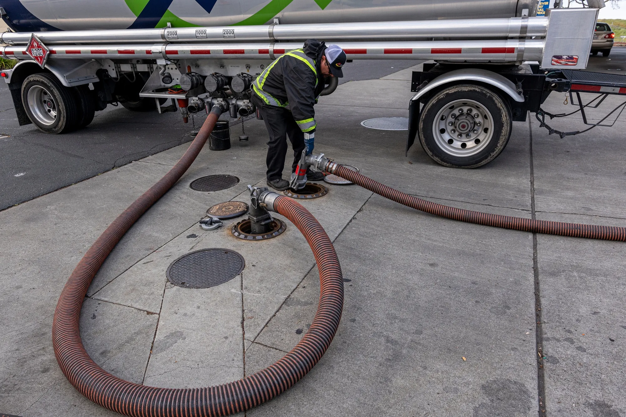 A distributor delivers fuel to a gas station in Hercules, California, U.S.