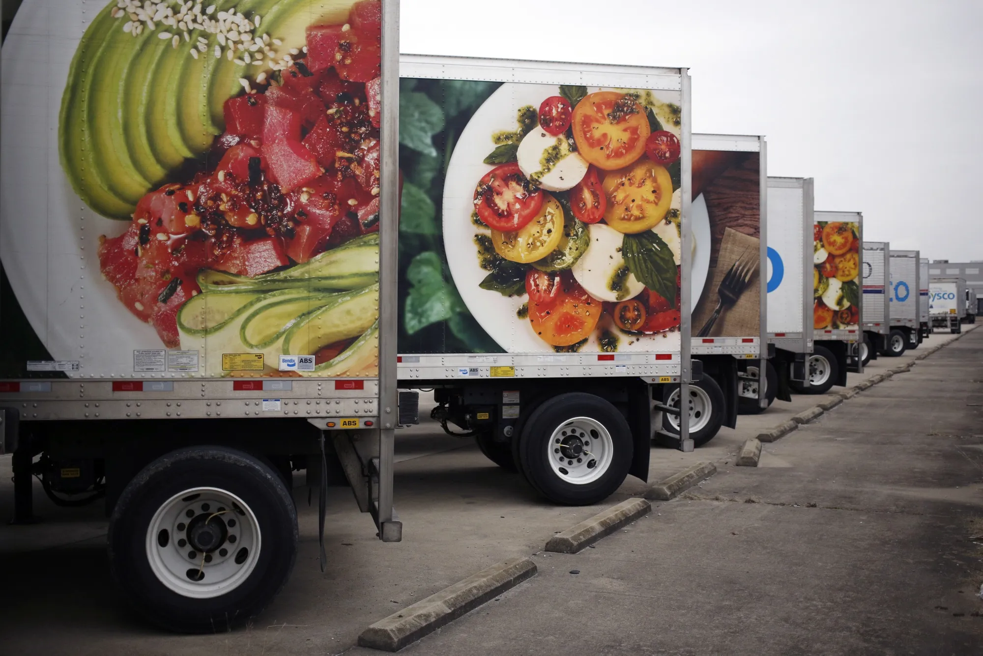 Sysco Corp. delivery trucks sit parked outside the company's distribution center in Louisville, Kentucky.