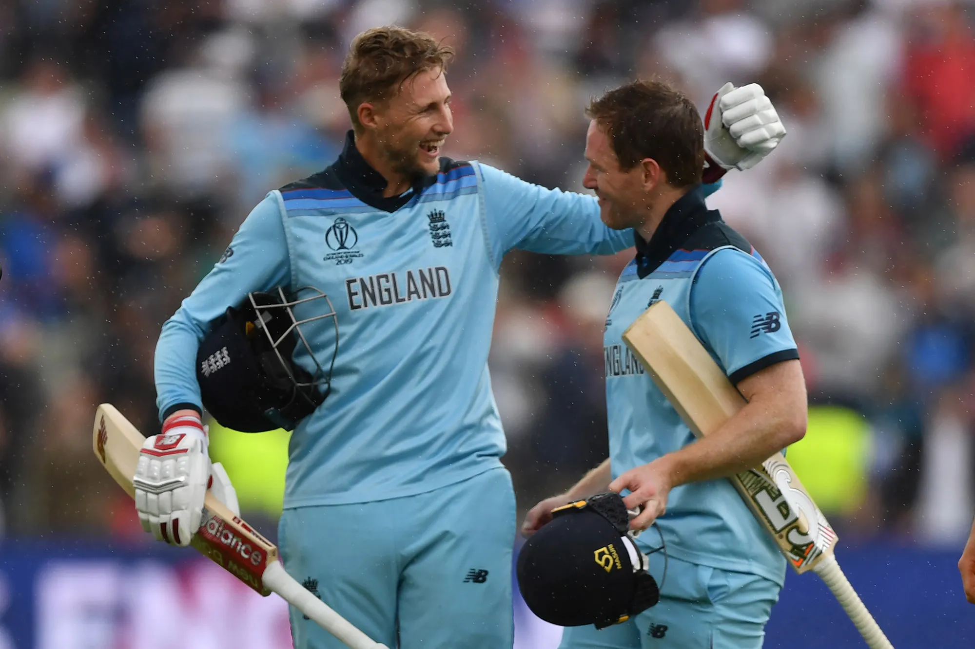 Eoin Morgan and&nbsp;Joe Root celebrate victory at close of play during the 2019 Cricket World Cup second semi-final.&nbsp;