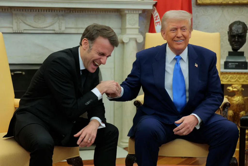 Donald Trump and French President Emmanuel Macron met in February 2025. No one’s laughing now.&nbsp;