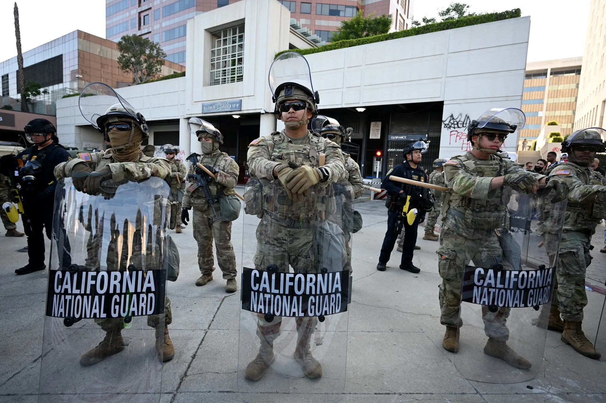 Members of the California National Guard stand guard outside of&nbsp;the Roybal Federal Building in Los Angeles, on June 12.