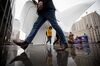 Pedestrians pass in front of the Oculus transportation hub in New York, U.S., on Friday, March 1, 2019. A rally in shares of technology companies helped push the broader U.S. equity market up from the lows of the day. Treasuries fell for a third day and oil slumped.