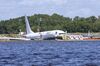 A Boeing 737 arriving from Cuba sits in a river after slipping off the end of a runway in Jacksonville, Florida on Saturday, May 4.