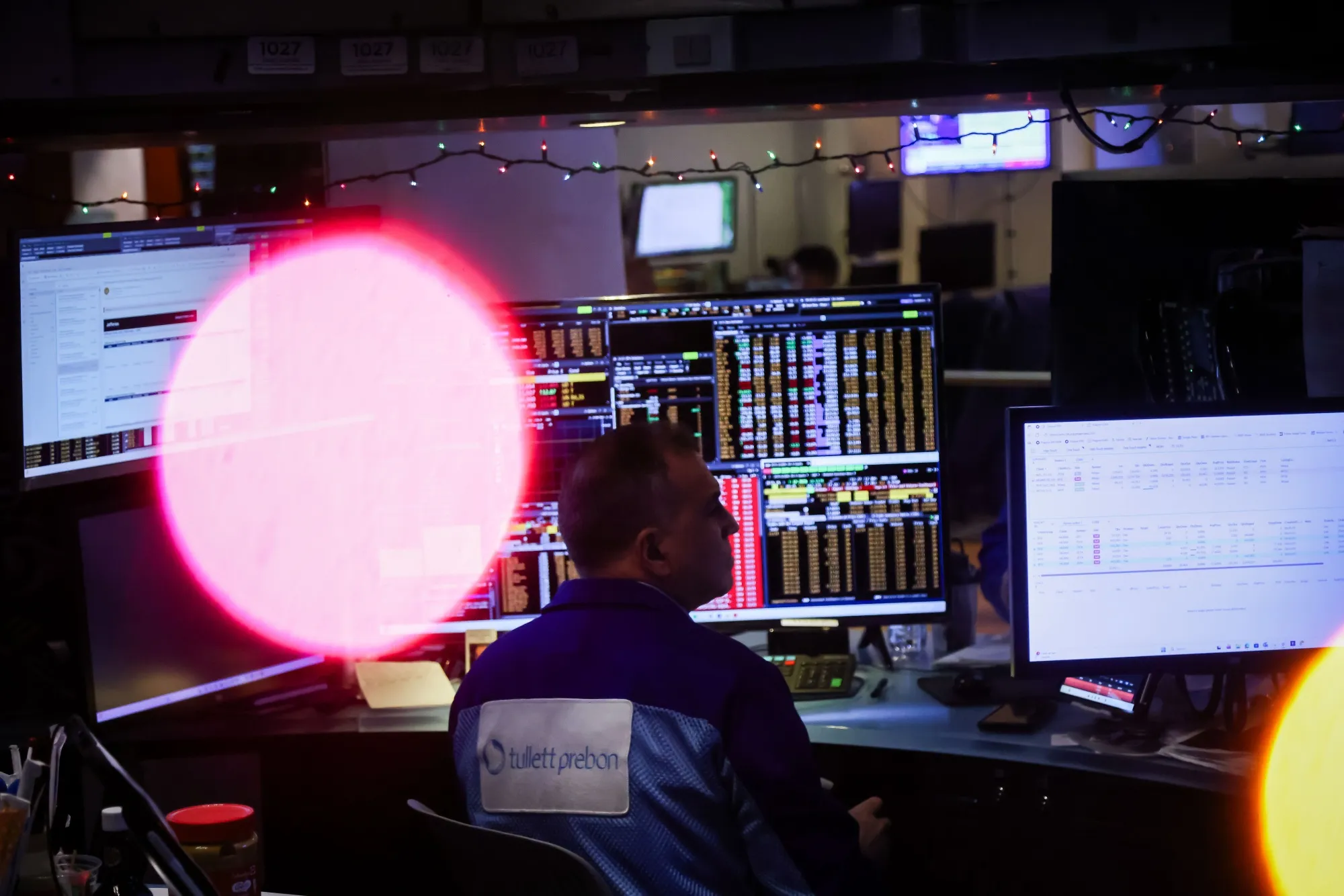 A trader works on the floor of the New York Stock Exchange.