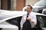 Elon Musk, chief executive officer of Tesla Inc., arrives at court during the SolarCity trial in Wilmington, Delaware, U.S., on Tuesday, July 13, 2021. Musk was cool but combative as he testified in a Delaware courtroom that Tesla's more than $2 billion acquisition of SolarCity in 2016 wasn't a bailout of the struggling solar provider.