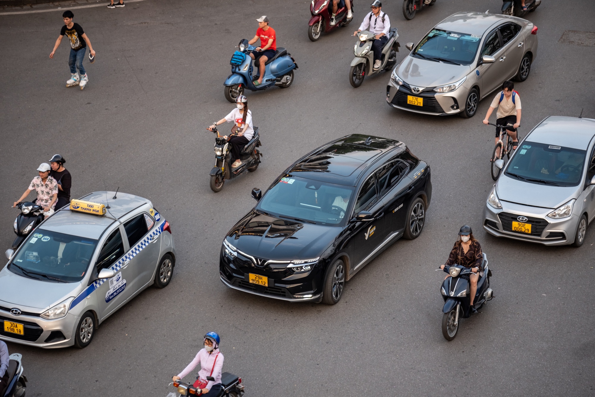 VinFast Auto Ltd. electric vehicle VF 8 model, center, drives along a road in Hanoi, Vietnam, on Friday, May 10, 2024. The EV maker controlled by Pham Nhat Vuong is trying to break into the global market at a time when Chinese competitors are increasing exports while Tesla Inc. slashed prices last month. Photographer: Linh Pham/Bloomberg
