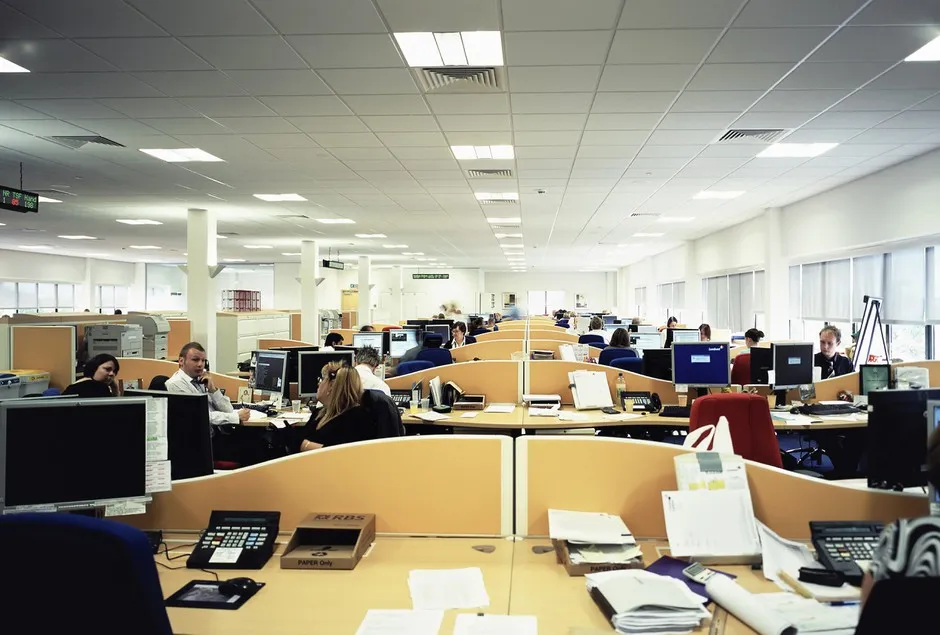 About 7 out of 10 offices share an open-plan design like this. It is hardly ideal for halting contagion.