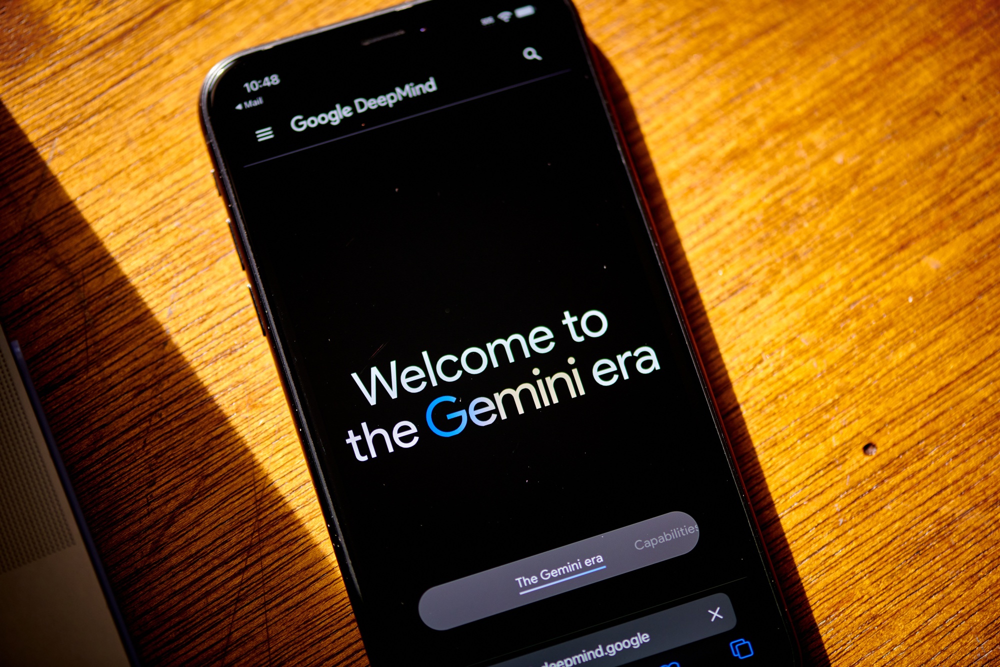 The Google DeepMind website on a smartphone.