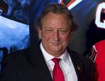 Ottawa Senators team owner Eugene Melnyk attends an NHL hockey news conference Dec. 4, 2014, in Ottawa. The Senators say Melnyk has died from an illness at age 62. The team announced the news with a statement from his family. (AP Photo/The Canadian Press, Adrian Wyld, File)