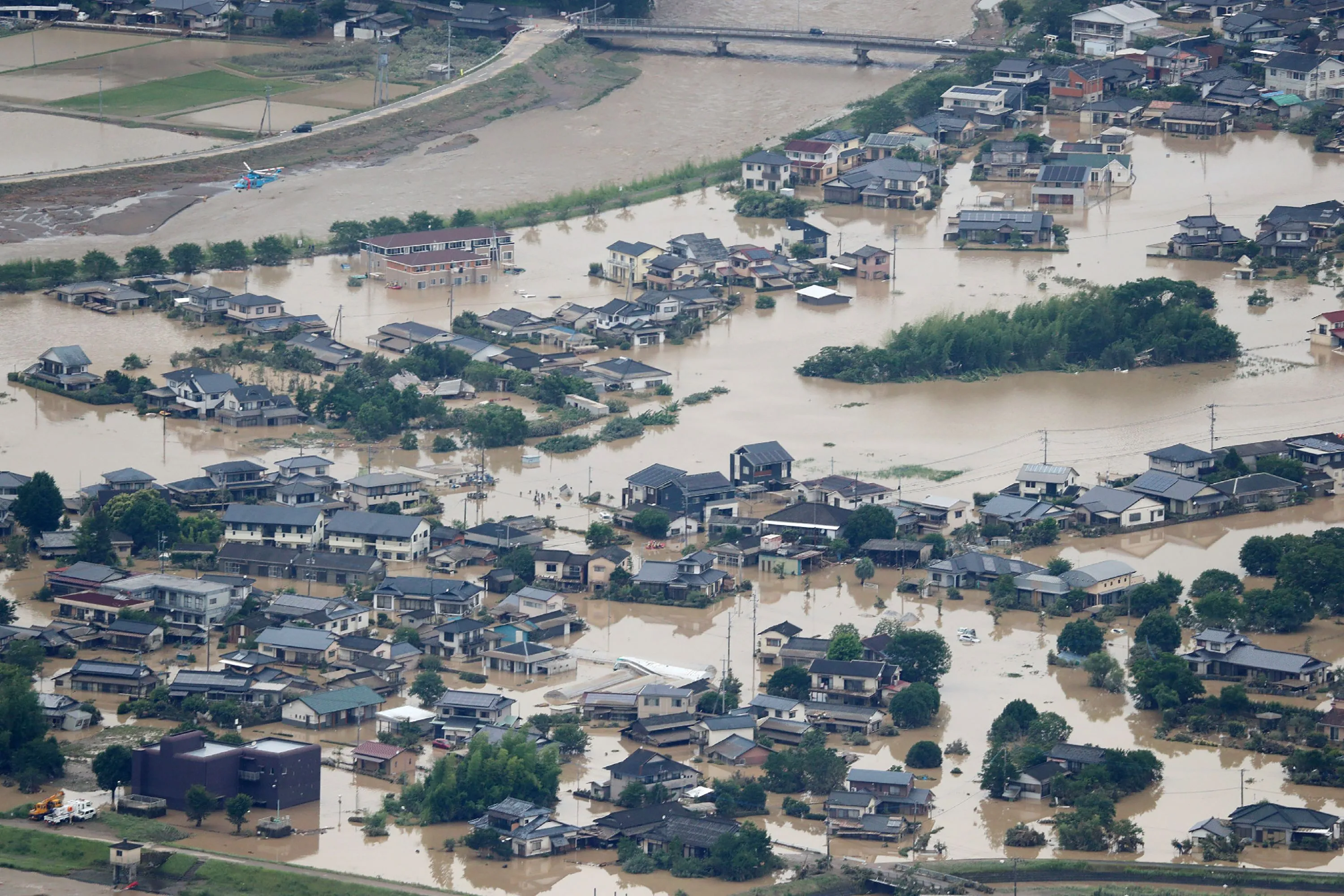Houses surrounded by flood water due to heavy rain in Hitoyoshi, Kumamoto, Japan,&nbsp;July 4.
