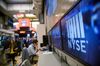 A monitor displays New York Stock Exchange (NYSE) signage on the floor of the NYSE in New York, U.S., on Friday, Sept. 22, 2017. U.S. stocks were little changed, while Treasuries gained with gold as investors reached for safe haven assets after North Korea ratcheted up its threats against the U.S.