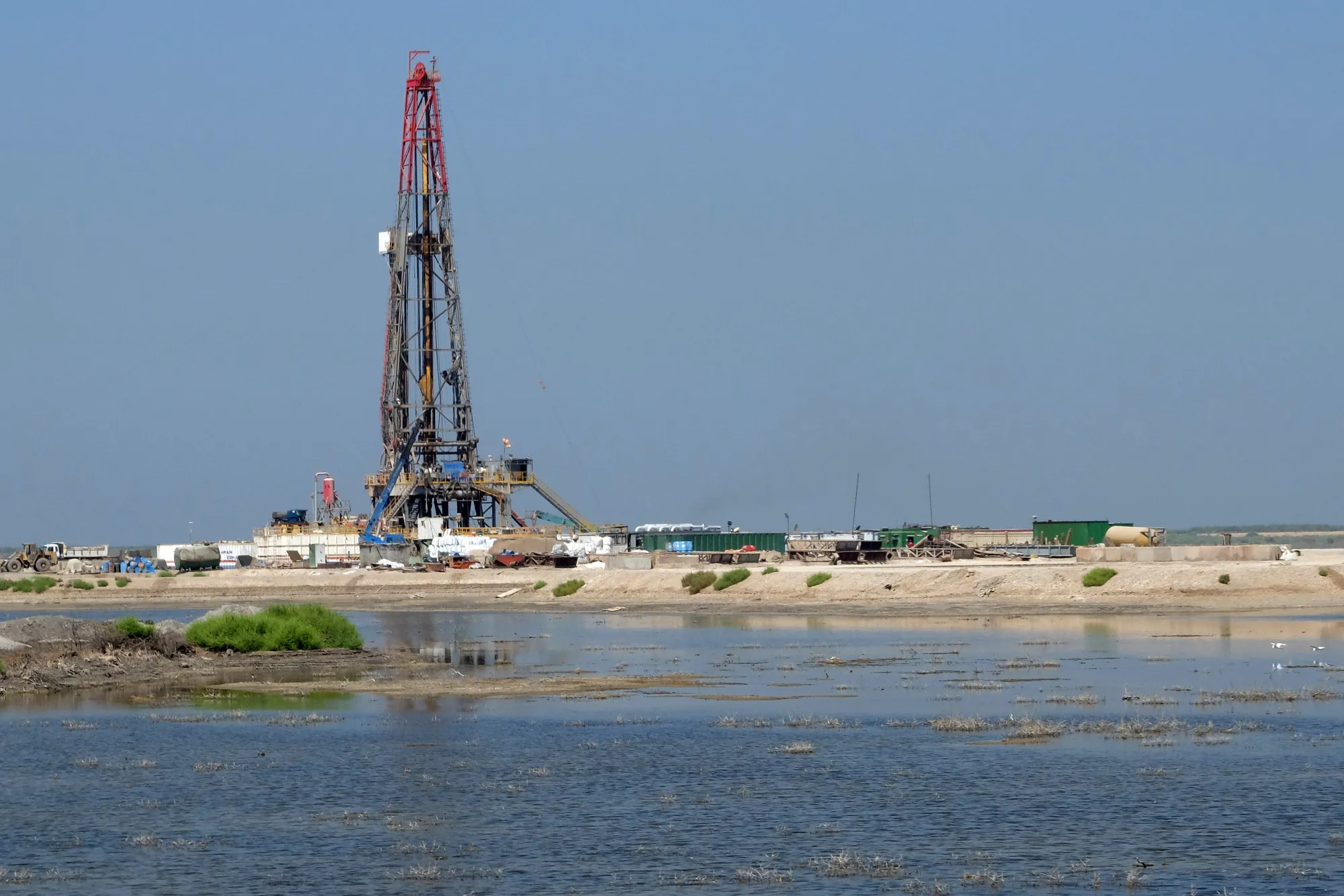An oil drilling rig of the Azadegan fields sits in wetlands, in Iran.

